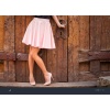 stock-photo-girl-wearing-nude-colored-skirt-and-high-heel-shoes-1171400185-transformed